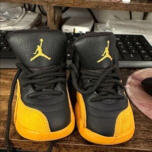 Kids Black and Yellow Jordan 12s